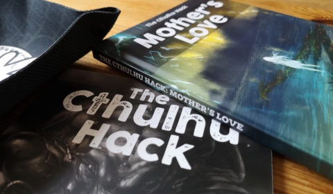 Promoting hardback book release with picture of Mothers Love, The Cthulhu Hack core book and dice tray